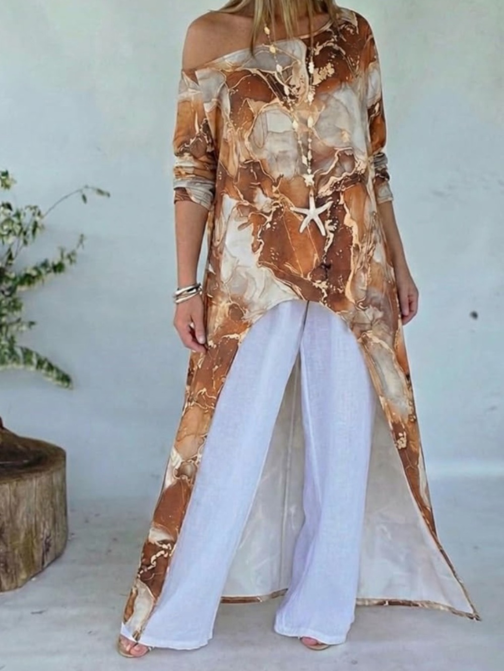 Flowy high-low tunic with marble-inspired brown and cream print. Lightweight, re
